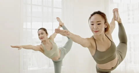 Group young Asian women practicing yoga in sport wear in clean gym. Stock Footage 165606831