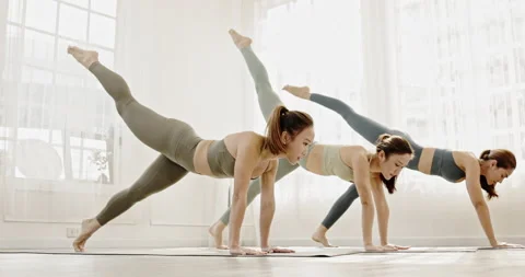 Group young Asian women practicing yoga in sport wear in clean gym. Stock Footage 165606980