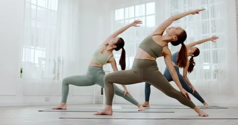 Group young Asian women practicing yoga in sport wear in clean gym. Stock Footage 176979486
