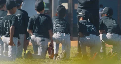 Group of young baseball team getting pep talk from coach Stock Footage 231947459