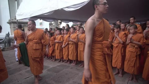 A group of young Buddhist monks attend a Buddhist ceremony Видео 342423091