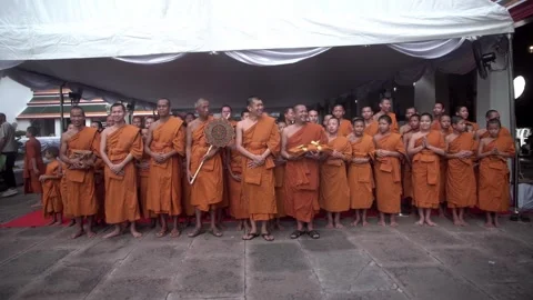 A group of young Buddhist monks attend a Buddhist ceremony Stock Footage 342437403