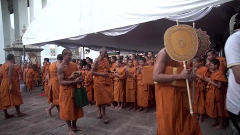 A group of young Buddhist monks attend a Buddhist ceremony Stock Footage 342437616