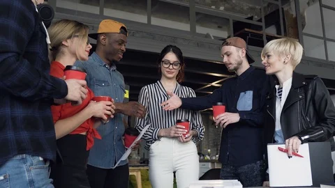 Group of young business partner shaking hands to each other. Stock Footage 108408724