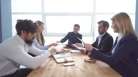 Group of young businessman at the negotiating table in the office. Colleagues Stock Footage 76201217