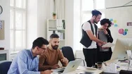 Group Of Young Businesspeople With Laptop Working Together In A Modern Office. Stock Footage
