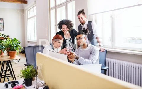 Group of young businesspeople working in office, start-up concept. Stock Photos