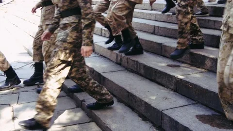 A group of young cadets descending the steps in the park, slow motion footage Video stock 237831424