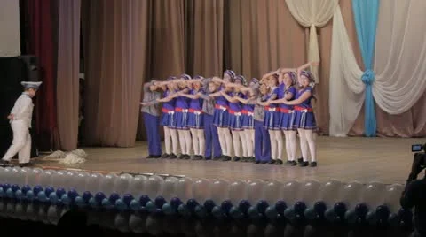 Group of young children performing a dance on stage Stock Footage 21710023