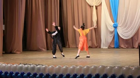 Group of young children performing a dance on stage Stock Footage 21722003
