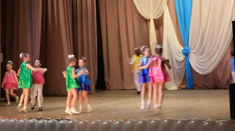 Group of young children performing a dance on stage Stock Footage 21759062