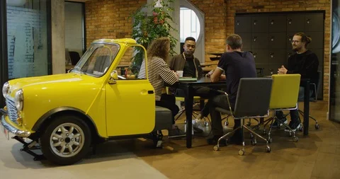 A Group of Young Creative Professionals Meeting in Modern Coworking Office - Stock Footage 129043238