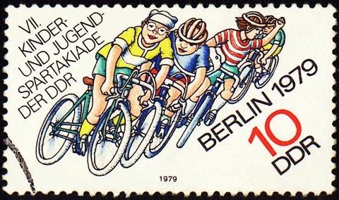 Group of young cyclists on post stamp Foto stock