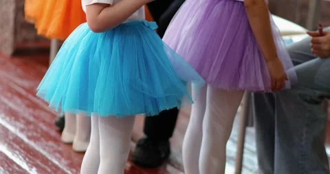 Group of young dancers at a dance class, each wearing brightly colored tutus Video stock 305896314