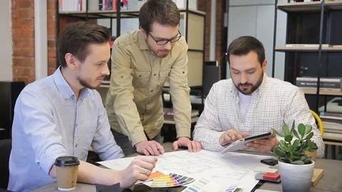 Group of young designers working on a drawing tablet. Stock Footage 77451342