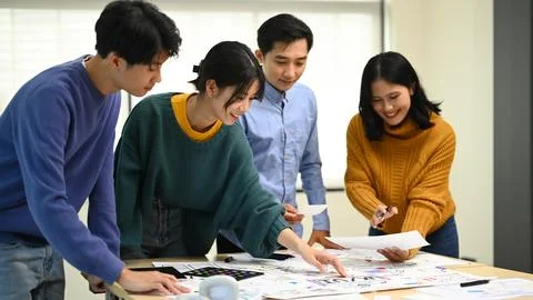 Group of young developers working on new website wireframe, planning application Stock Photos