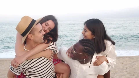 Group of young diverse friends having fun in summer on the beach Stock Footage 242510500