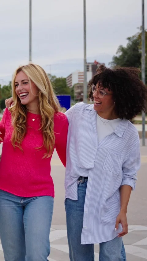 Group young diverse friends walking relaxed and talking to each other and Stock Footage 275621214