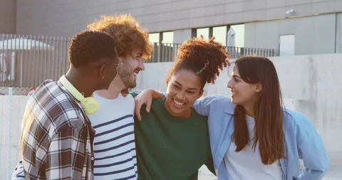 Group of young diverse millennials having a good time during a sunset in a city Stock Footage 265038087