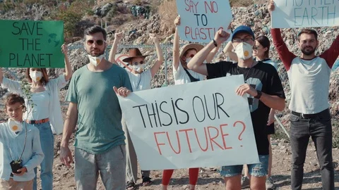 Group of young ecology activists shouting holding agitation posters invoking to Stock Footage 113924843