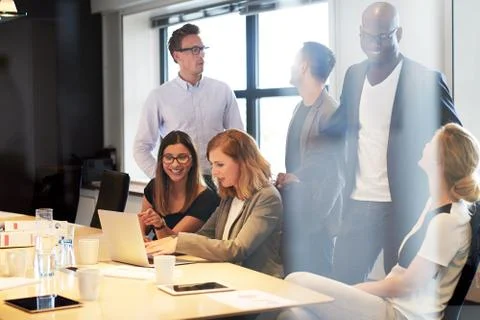 Group of young executives socializing Stock Photos