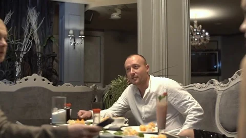 Group of young friends are having fun in the restaurant, drinking cocktails. Stock Footage 83650633