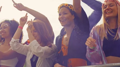 Group Of Young Friends Dancing Behind Barrier At Outdoor Music Festival  With Stock Footage 312678136