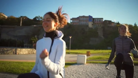 A group of young friends doing high knees exercise outdoors slow motion Stock Footage 70966102