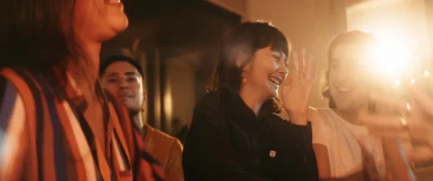 Group of young friends having fun and dancing while sitting on couch Stock Footage 202265844