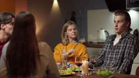 Group of young friends having talk at dinner Video stock 114814527