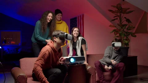 Group of young friends playing virtual videogame Stock Footage 147397902