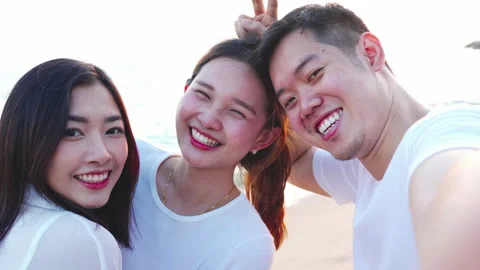 Group of young friends posing while taking a selfie or making video call Video stock 171901288