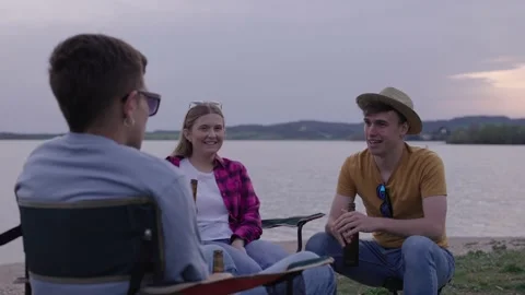 Group of young friends talking together outdoors Stock Footage 238353083