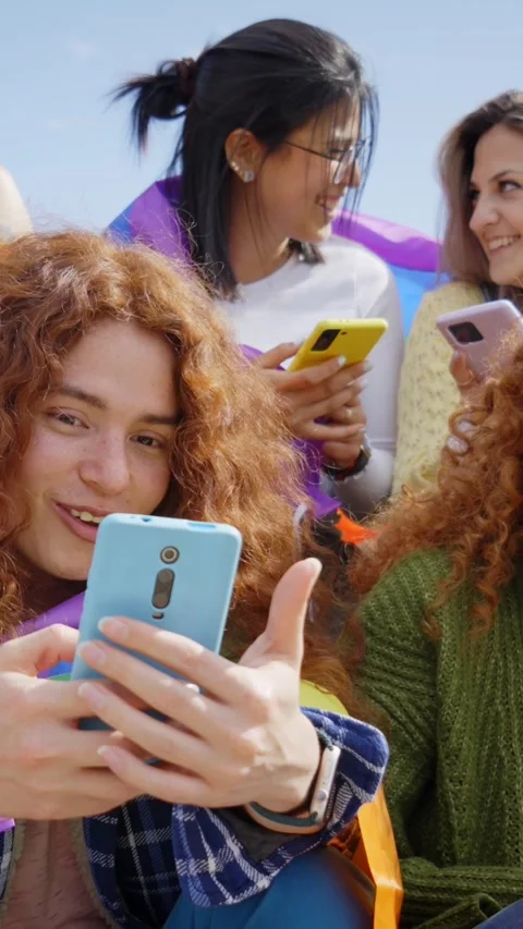 Group young friends watching mobile phone and celebrating gay pride festival day Stock Footage 269239672