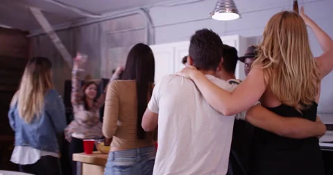 Group of young fun loving young mixed race friends partying and dancing in Video stock 58008771