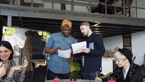 Group of young hipster working together on the new business plan. Stock Footage 108320825