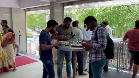 A group of young Indian men having breakfast Stock Footage 237812437