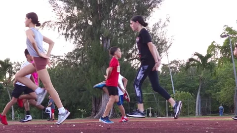 Group of Young Kids Doing Track and Field Workouts Drills Stock Footage 219592925