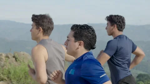 Group of Young Men Running Outdoors, Promoting Healthy Lifestyle. Stock Footage 282296192