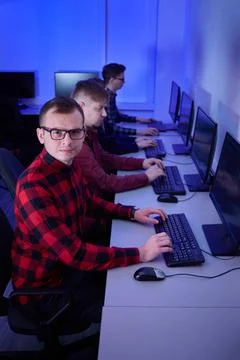 A group of young men work as programmers in the office. Esports players. Stock-Fotos