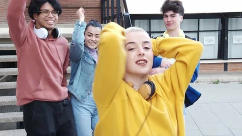 Group of young millennials dancing happily in a city. Urban dance Stock Footage 195200608