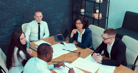 Group of young multi-ethnic designers, headed by a leader, is working on a Stock Footage 89263338