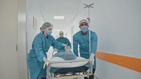 Group of young multi-ethnic paramedic doctors hurrying running through hospital Video stock 143680891