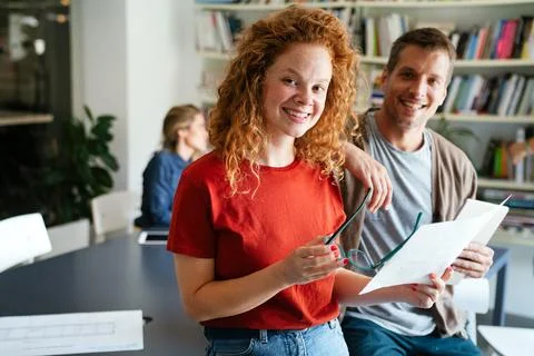 Group of young multi-ethnic startup business team collaborating on project in Stock Photos