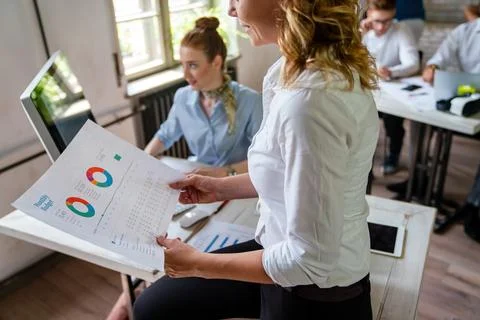 Group of young multi-ethnic startup business team collaborating on project .. 스톡 사진