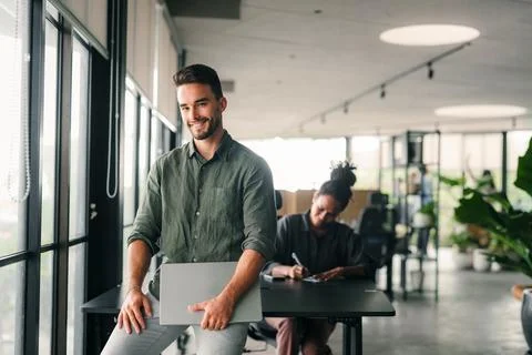 Group of young multi-ethnic startup business team collaborating on project .. Stock Photos