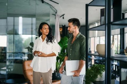 Group of young multi-ethnic startup business team collaborating on project in Stock Photos