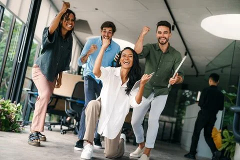Group of young multi-ethnic startup business team collaborating on project in Foto stock