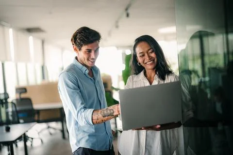 Group of young multi-ethnic startup business team collaborating on project .. Stock Photos