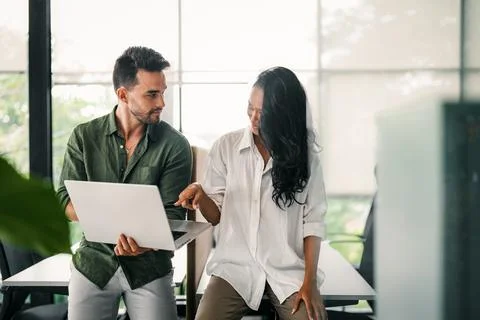 Group of young multi-ethnic startup business team collaborating on project in Stock Photos